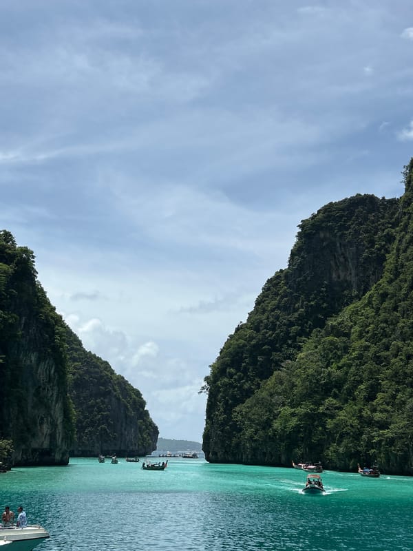 On a boat in Ao Nang's turquoise bay, bottles in hand