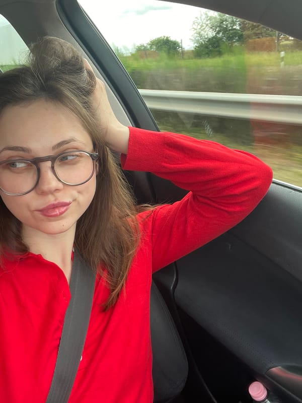 Woman in red observed driving through Kőszárhegy, Hungary