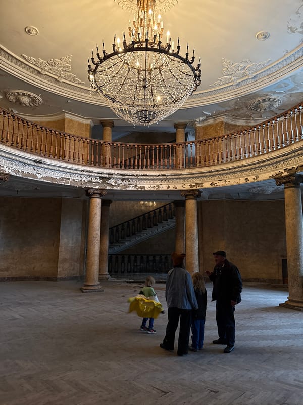 Witness documents deteriorating historical building interior in Tskaltubo, Georgia