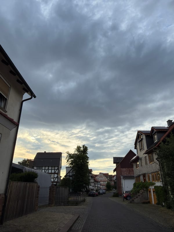 Street-level and sky views in a cloudy European town