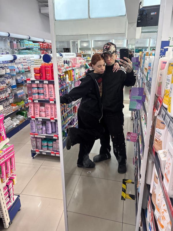 Two people take selfie in Buenos Aires store aisle