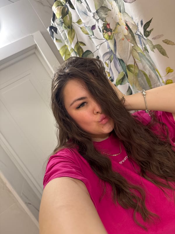 Woman takes selfies with pink iPhone in Russia