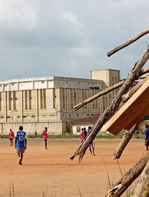 Pickup soccer and everyday scenes on a Jos dirt field
