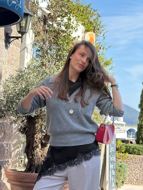 Motorboat docked at stone pier in Radovići, Montenegro