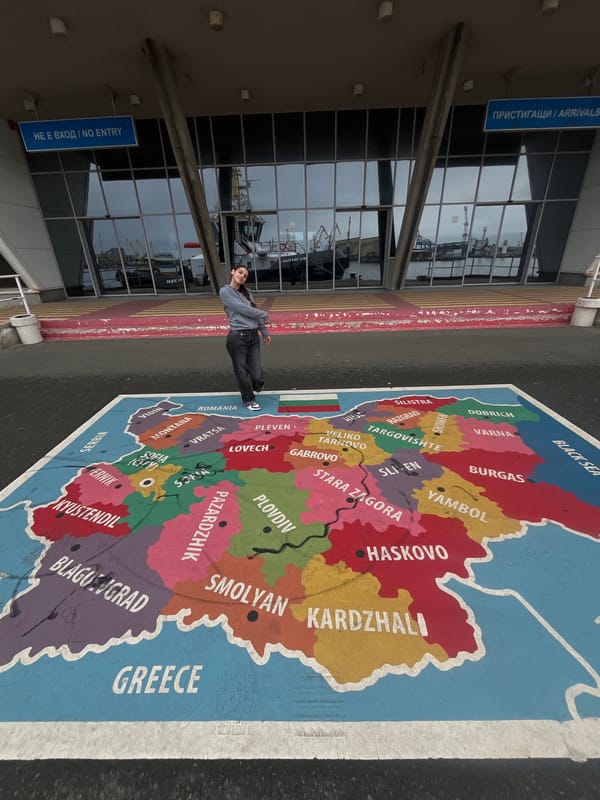 Tourists interact with painted Bulgaria map in Burgas