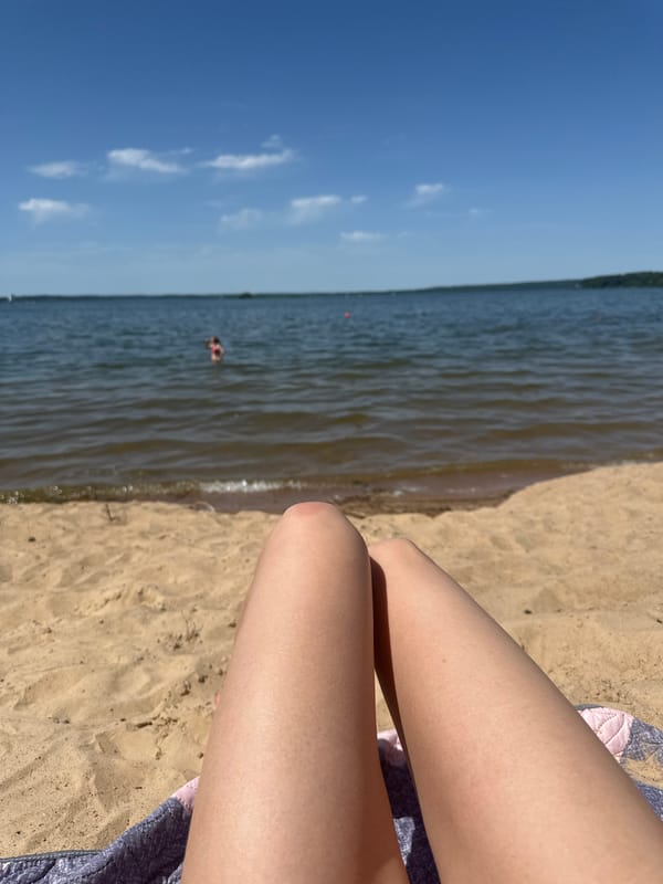 Relaxing on a calm Belarusian beach in late June