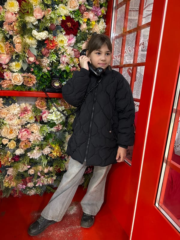 Child explores toy store, art installation in Korobovo