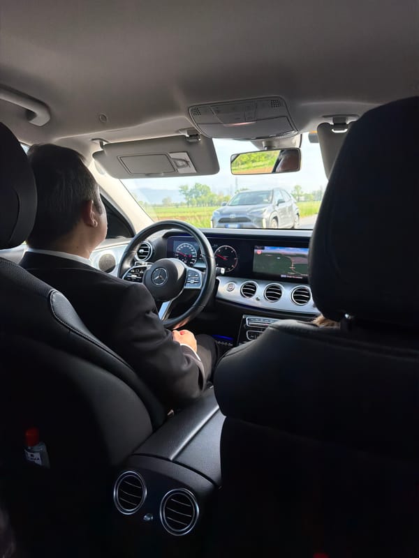 Man in suit photographed sleeping in car in Vicenza