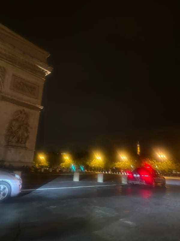 Nighttime illumination captured at Arc de Triomphe in Paris