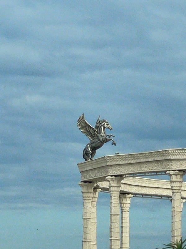 Aktau's Caspian promenade: statues, blooms, and coastal views