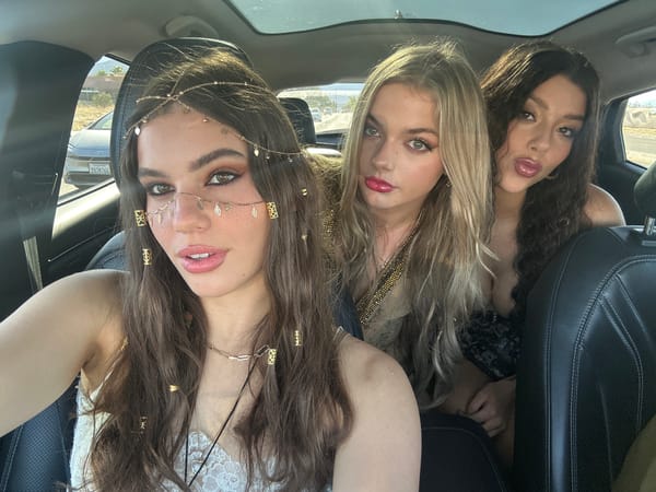 Three women pose for car photo in Rancho Mirage