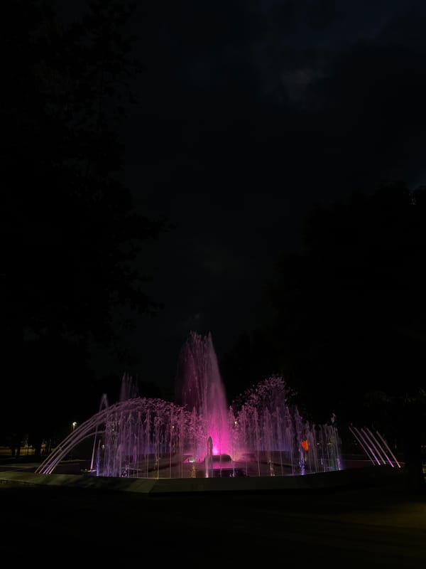 Colorful illuminated fountain lights up a Pleven night