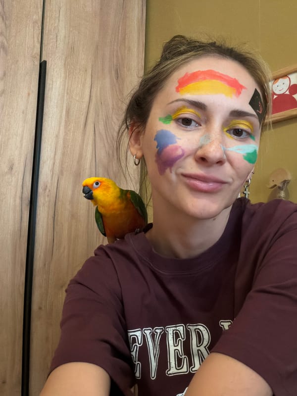 Mother, daughter face painting session with pet parrot in Khimki