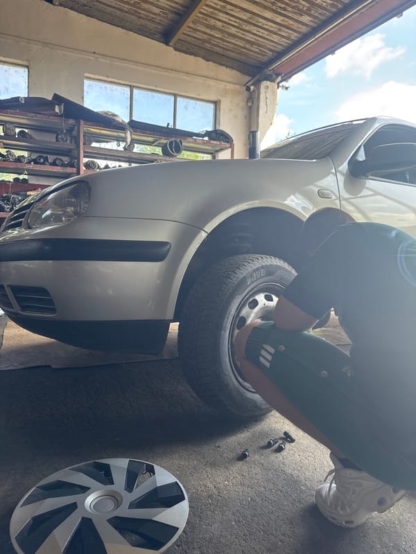 Car maintenance underway at Yambol garage, wheel removed