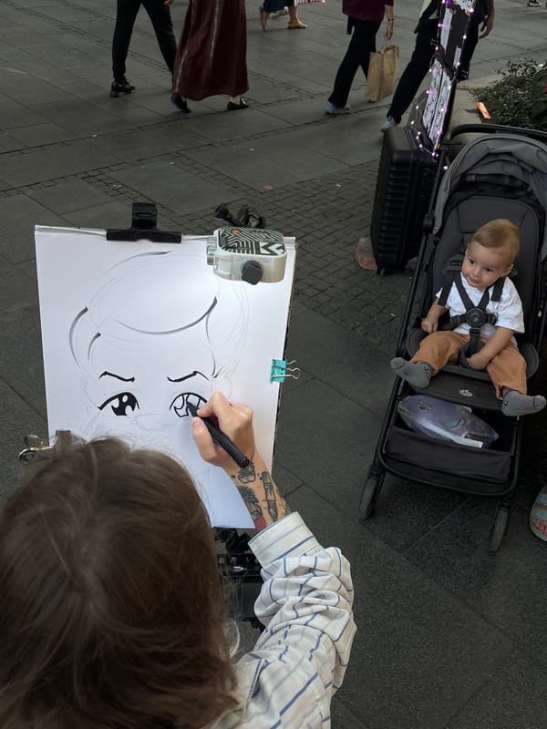 Street caricature artist at work on Belgrade's main pedestrian promenade