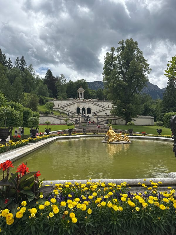 Linderhof Palace gardens and Ettal village on a cloudy morning
