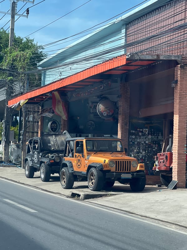 Street scenes from Ko Samui: cars, traffic, and a café