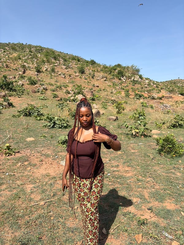 Woman photographed on hillside in Jos, Nigeria