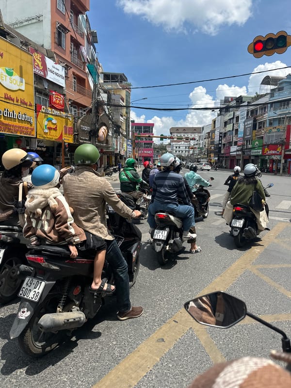 Morning street life in Đà Lạt: vendors, traffic, and fuel stops