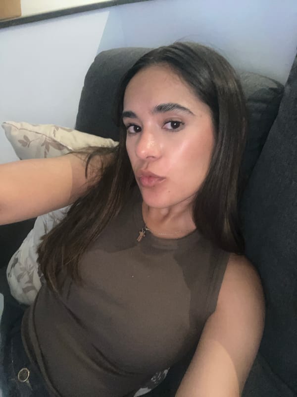 Woman rests on sofa in Tlaxcalancingo home