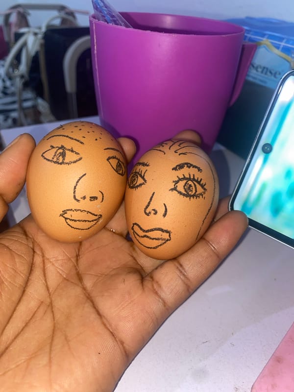 Artist creates egg faces and hand drawings in Nigeria