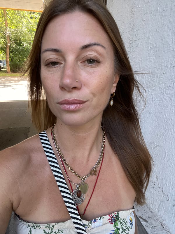 Casual selfie against a textured white wall in Moscow