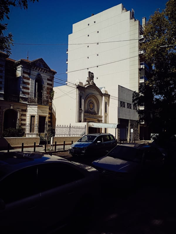 Buenos Aires street scene shows contrasting architectural styles