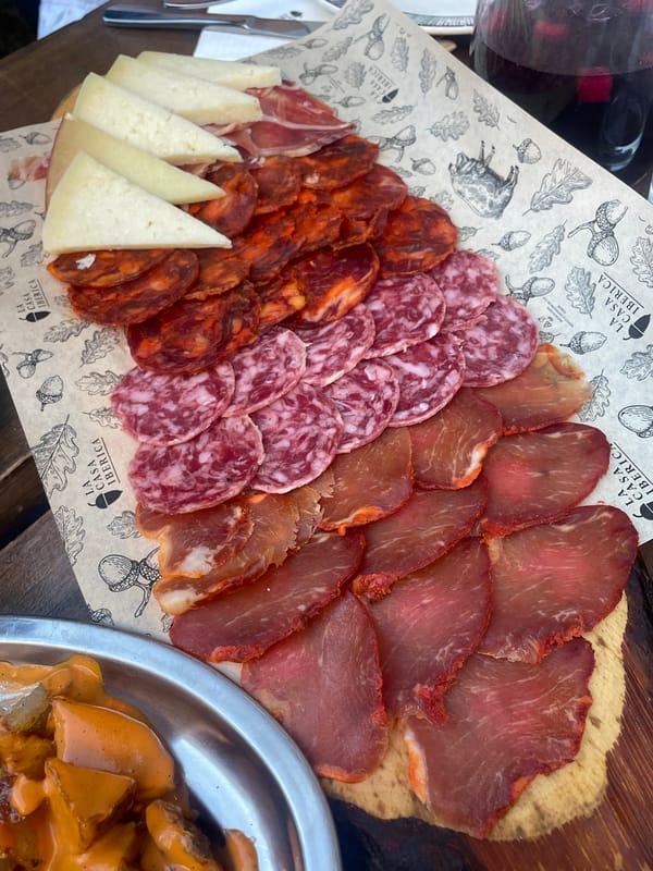Two women dine outdoors in Milan, share meal via video