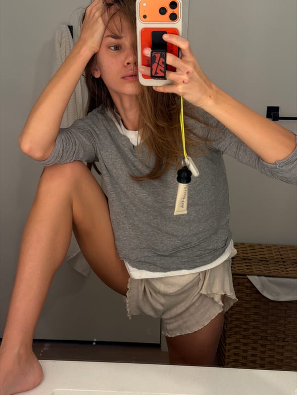 Woman takes bathroom mirror selfie in Fort Lauderdale
