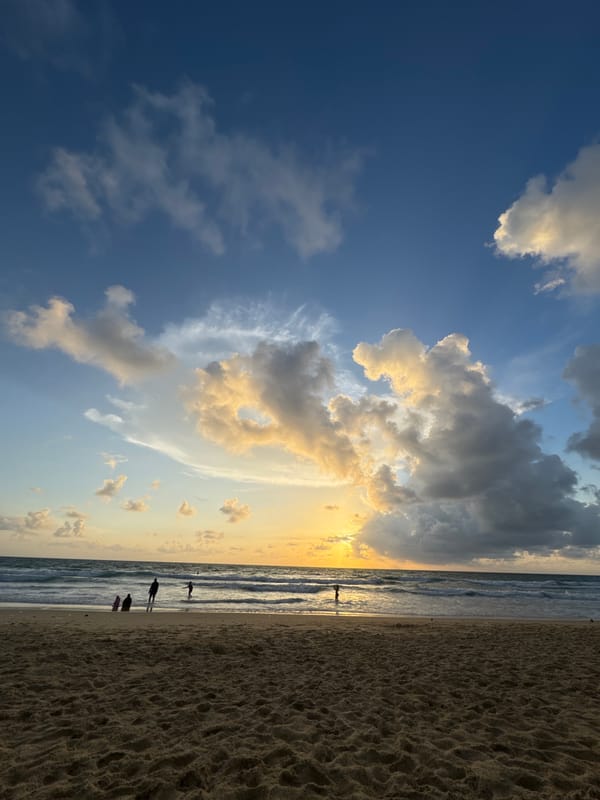 Sunset hour at Karon Beach, clouds and warm light over the water
