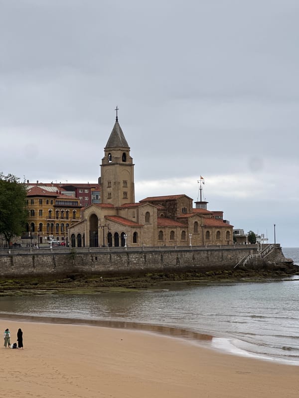 Witness documents historic architecture in Gijón, Spain under cloudy skies
