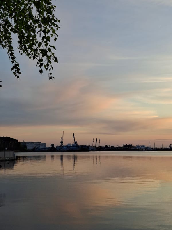 Sunset colors reflect over water in Chaikovsky, Russia