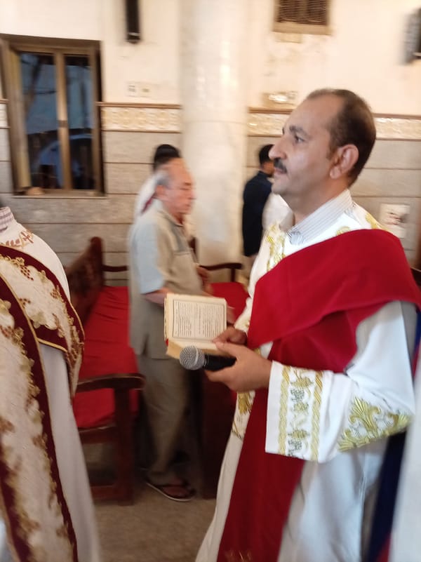 Orthodox clergy conduct religious service in ornate church
