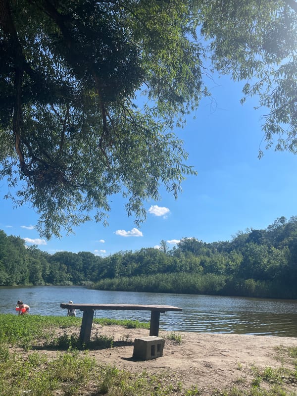 Selfies by a calm riverbank in Zarichne, Ukraine