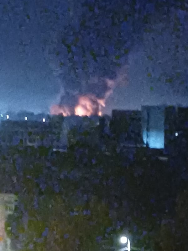 Large fire burns in Kyiv at night, smoke visible citywide