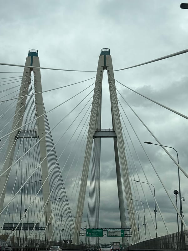Cable-stayed bridge documented under cloudy skies in Novosaratovka, Russia