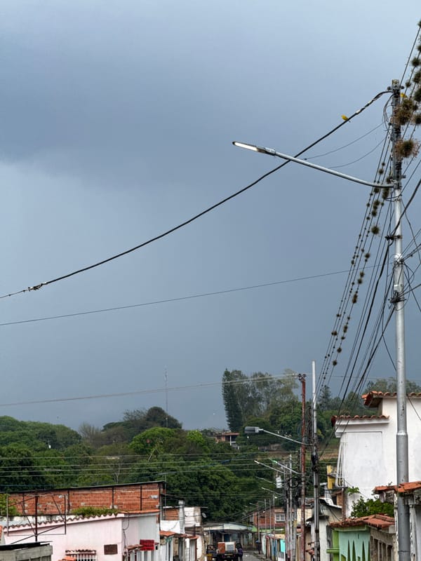 Street scene documented in Tinaquillo, Venezuela under overcast evening sky