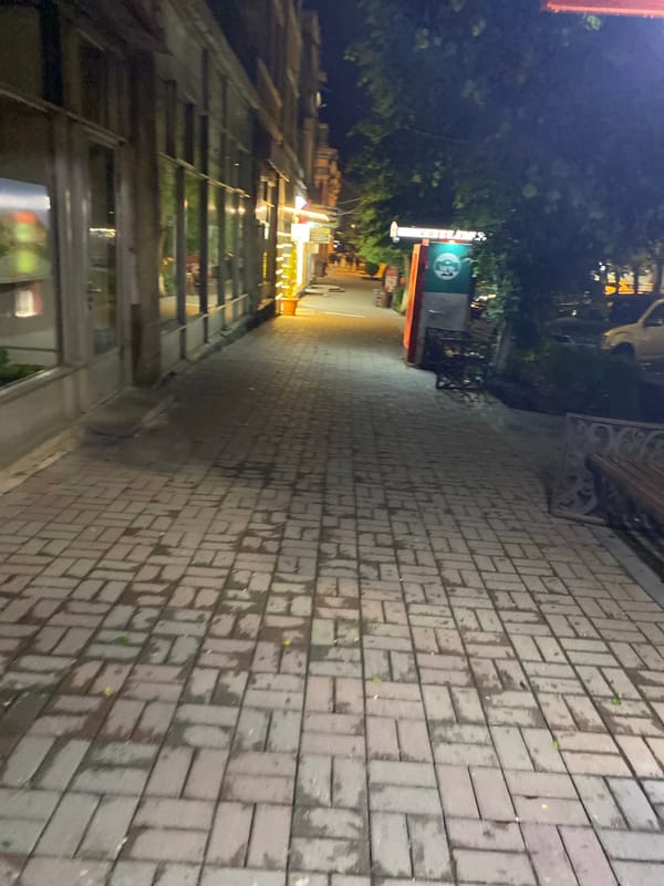 Rainy evening captured on Gyumri streets near October cinema