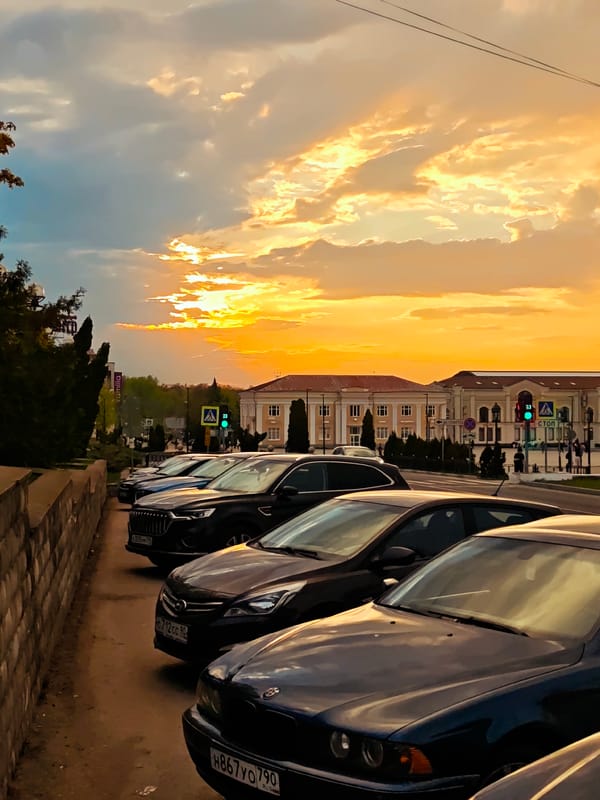 Evening scenes captured across Dmitrov, Russia show fountains, monuments