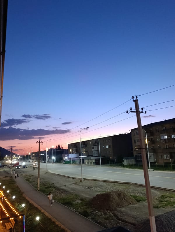 Twilight settles over the streets of Naryn City, Kyrgyzstan