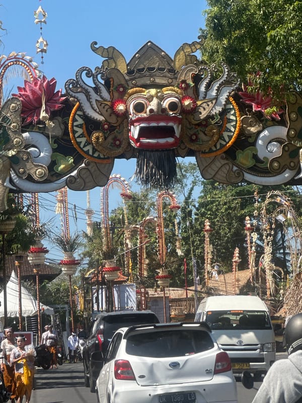 Traditional Balinese festival decorations and ceremonial procession in Sukawati