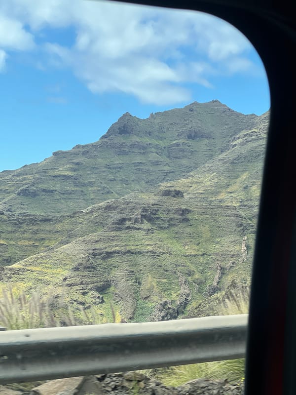 Driver documents colorful mountain geology along Mogán road