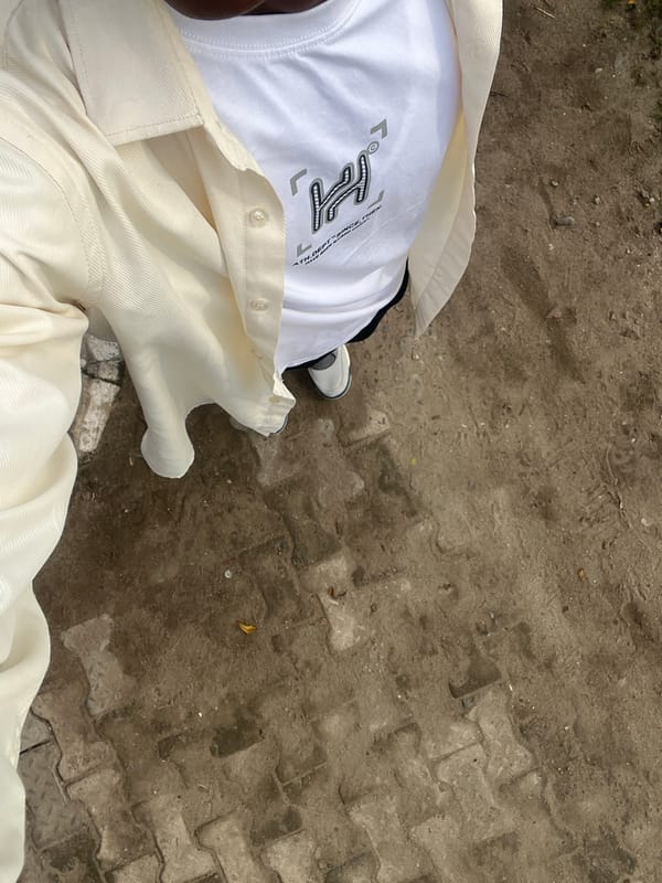Standing on terrazzo pavement in Lagos morning