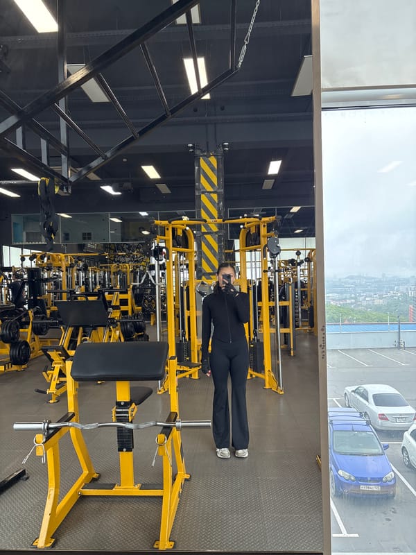 Vladivostok gym interior captured with yellow equipment, city view