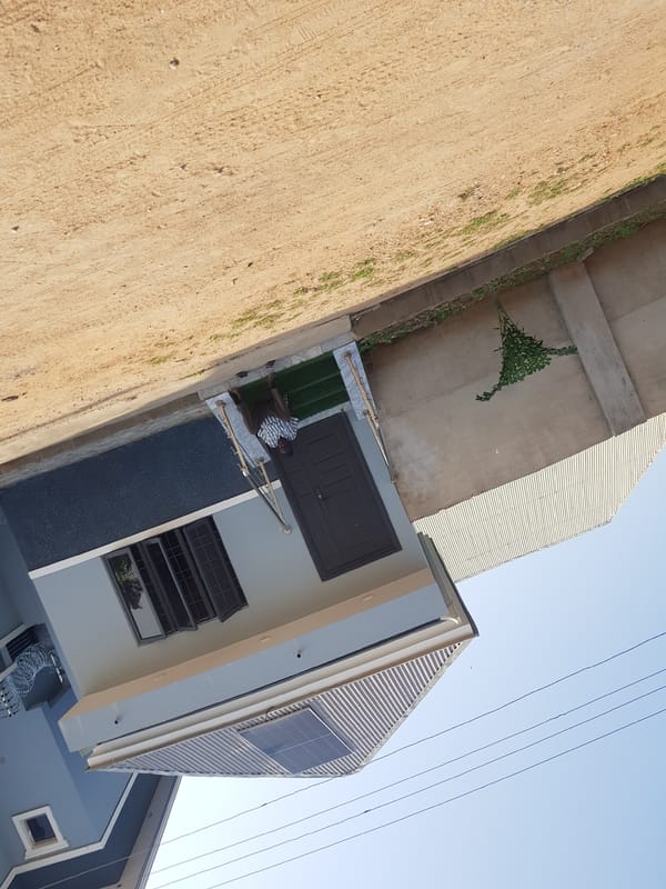 Morning street walk through a residential neighborhood in Palade, Nigeria