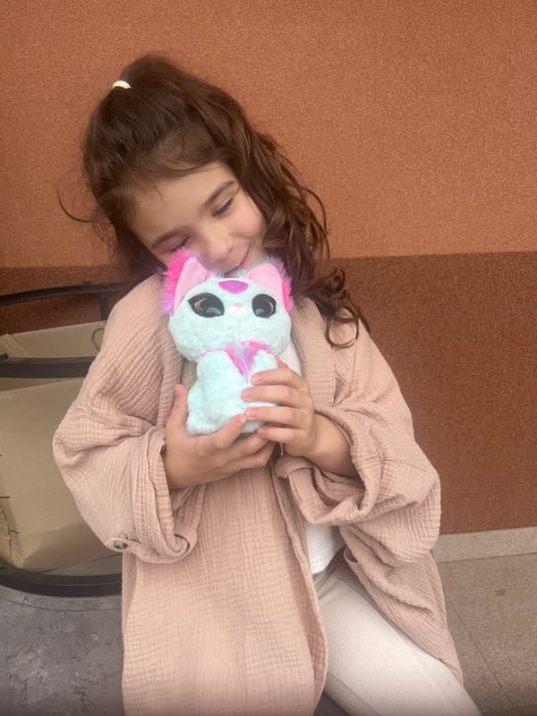 Young girl photographed with plush toy in Onokivtsi, Ukraine