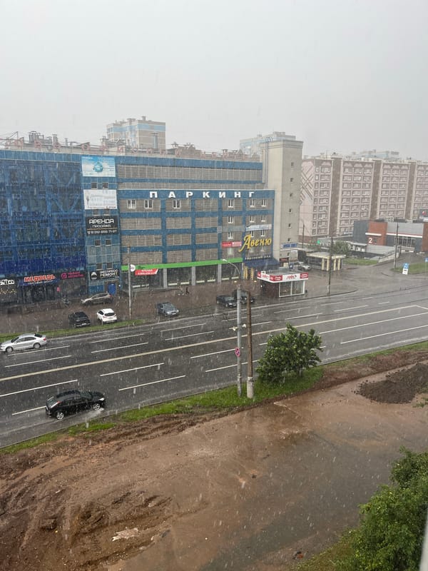 Summer rainstorm rolls through Izhevsk while people gather outside