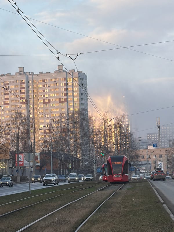 Red tram operates through hazy Izhevsk streets Friday afternoon
