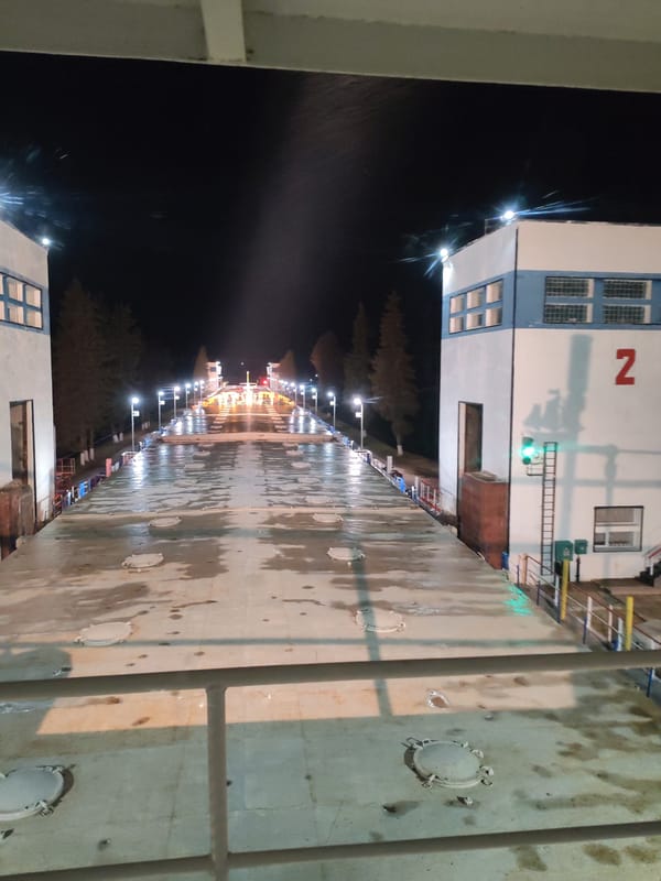Nighttime canal lock scene captured in Белоусово, Russia