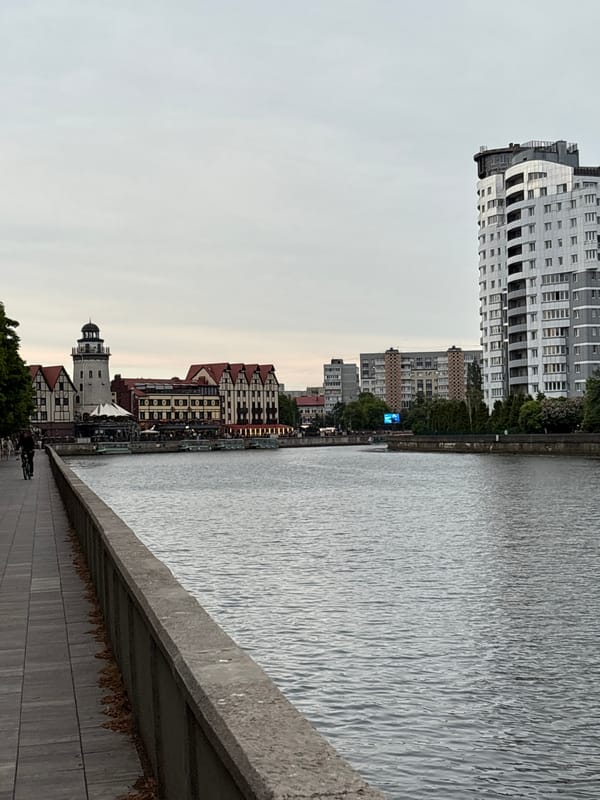 Tourist documents evening walk through historic Kaliningrad cathedral district